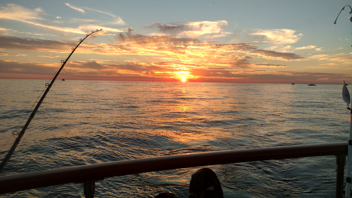 Large boat trolling in Lake Michigan just outside the Muskegon channel - fishing from the angler's perspective