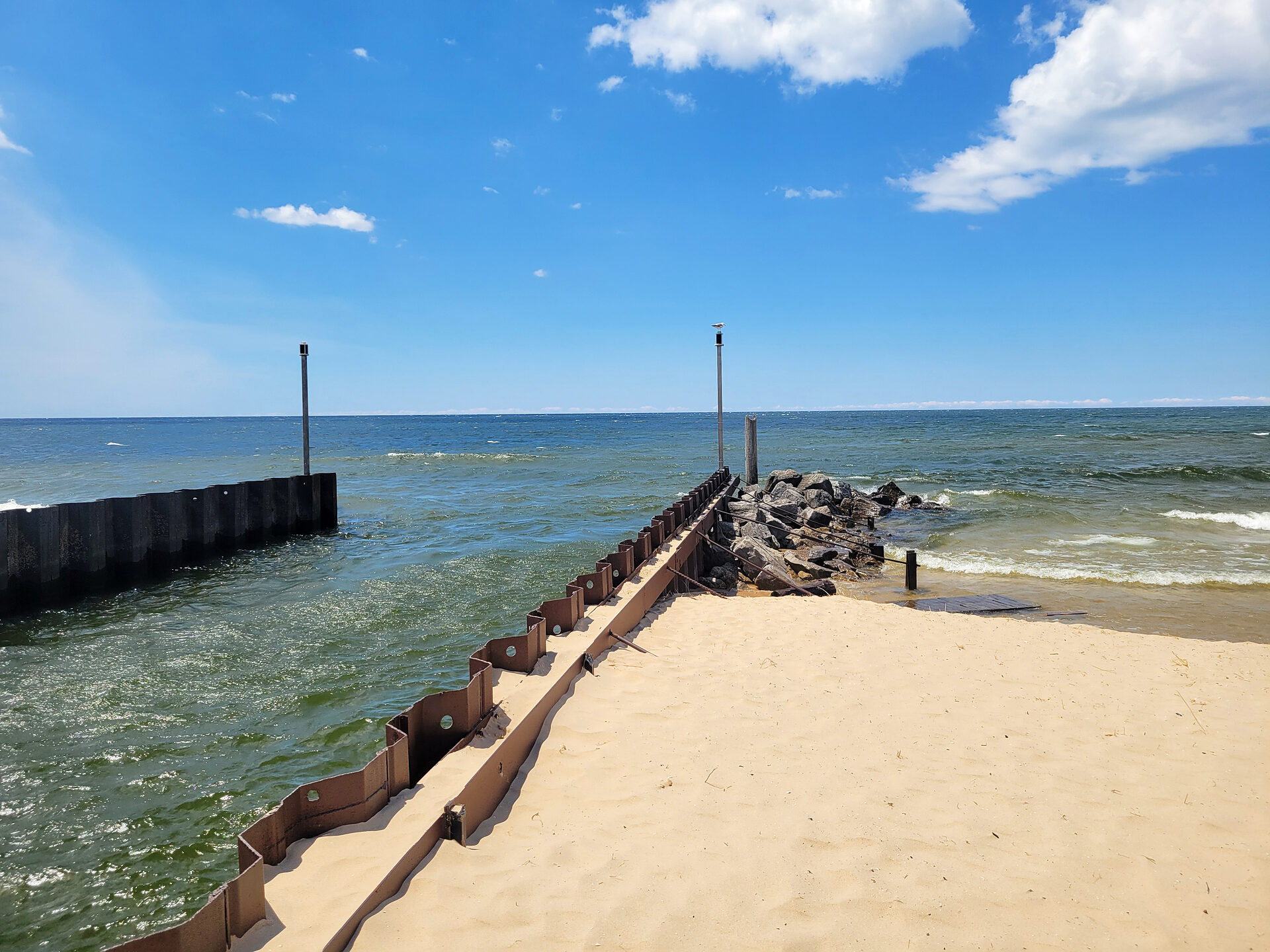 The Mona Lake channel meeting Lake Michigan at Lake Harbor Park in Norton Shores