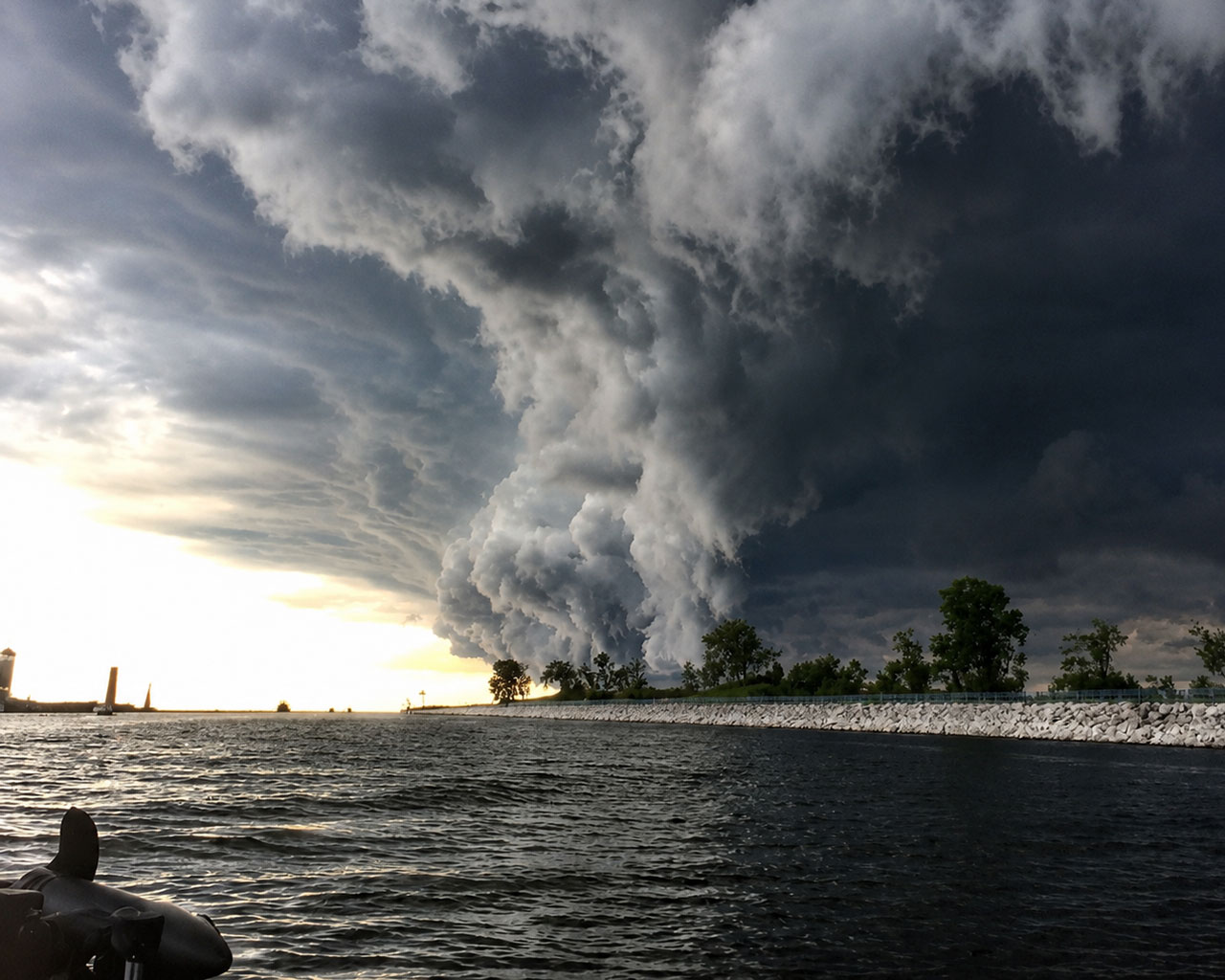 Fast-moving storm clouds towering over the calm Muskegon channel before the storm hit