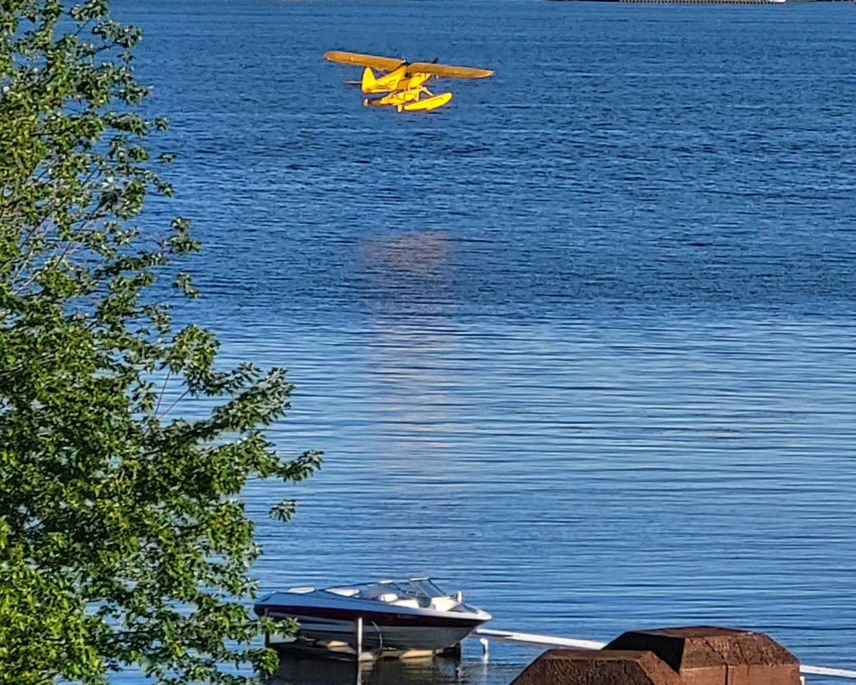 Seaplane landing on Muskegon Lake Michigan - the deep water port supports unique watercraft