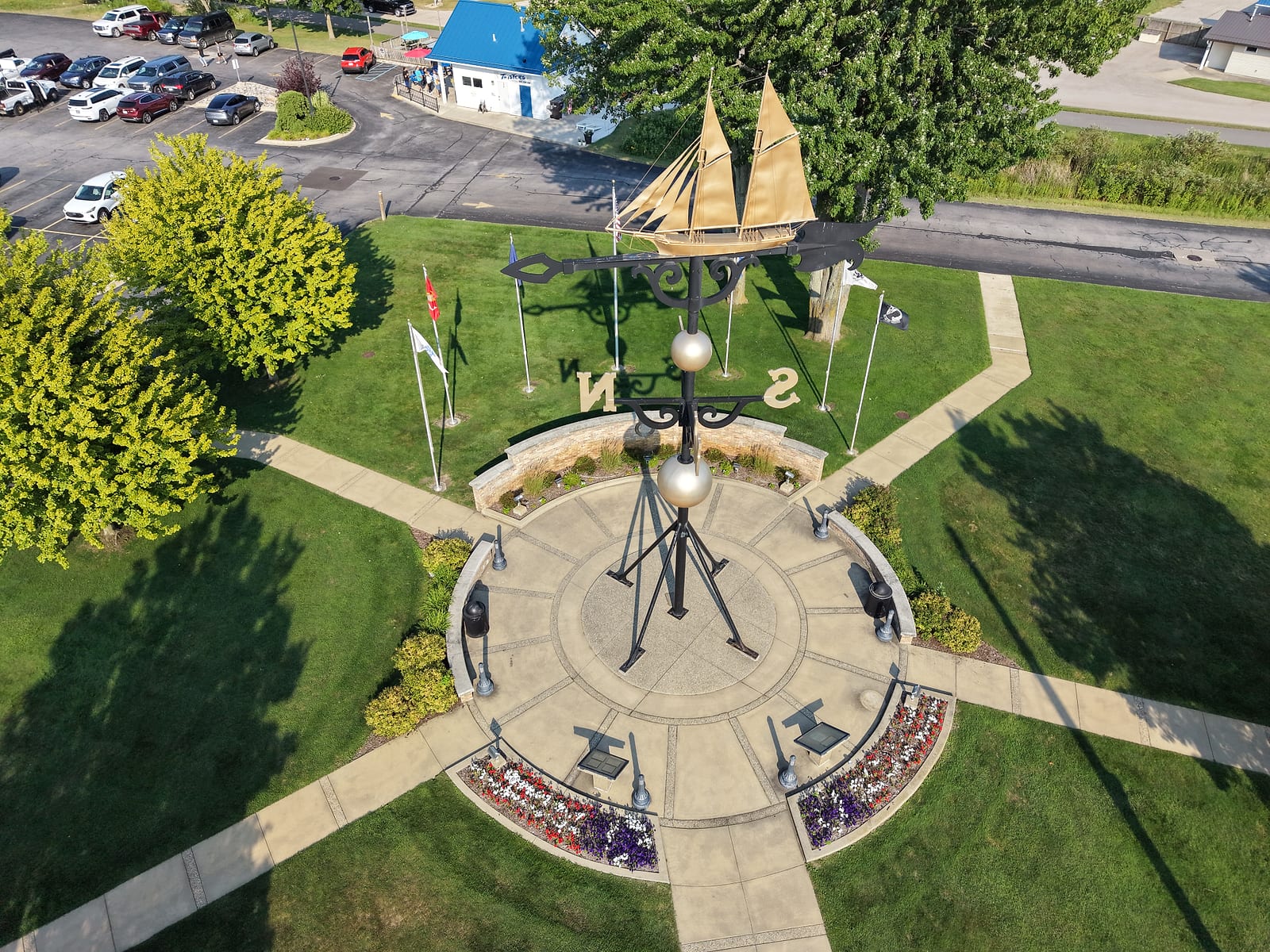 Aerial view looking down on the Ella Ellenwood schooner atop Montague's weathervane, with the compass plaza and flower beds below